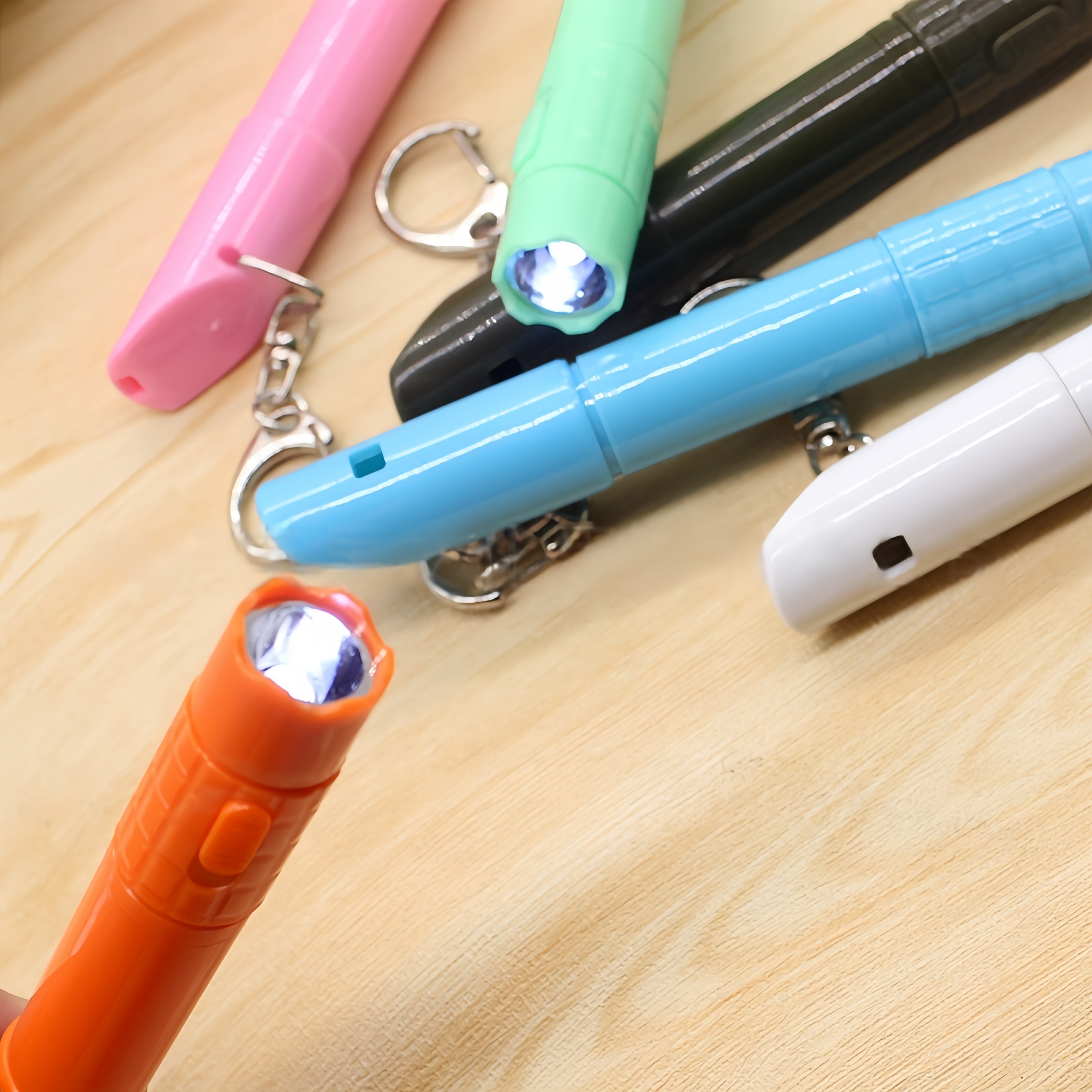 Whistle Pen With Flashlight Attached